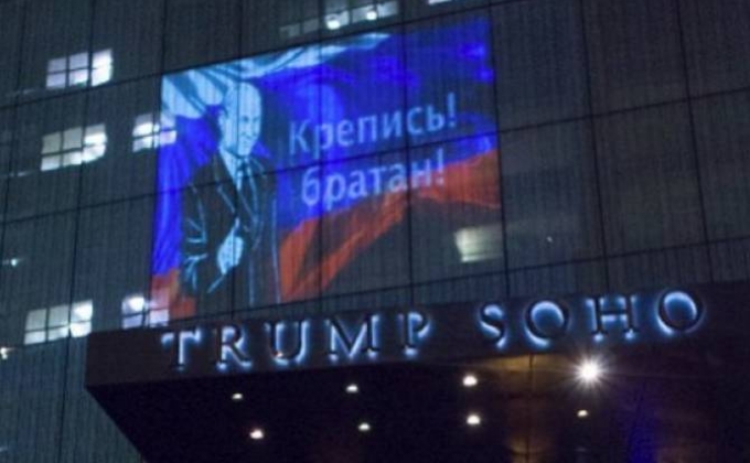 Putin image is projected on Trump hotel in New York