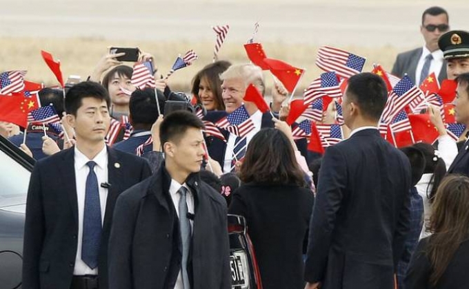 Trump arrives in China
