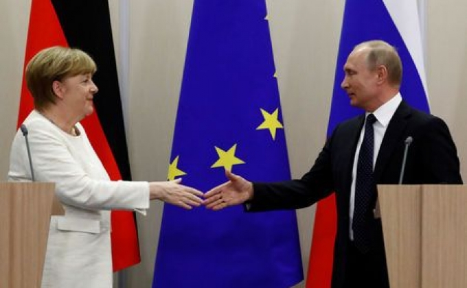Putin seeks common cause with Merkel over Trump