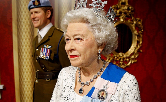 Queen Elizabeth wax figure in festive spirit at Madame Tussauds
