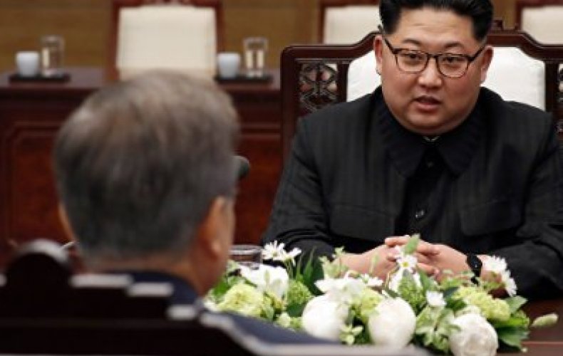 North Korea's Kim in China; U.S., South Korea suspend military drill