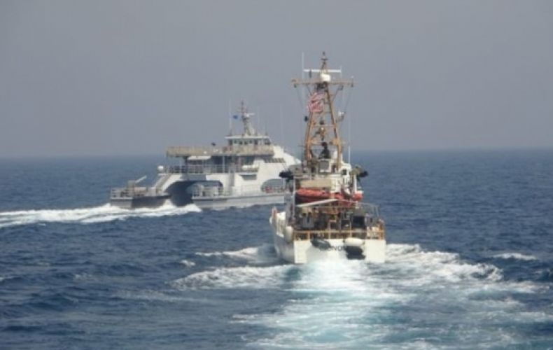 US warship fires warning shots at Iranian small boats
