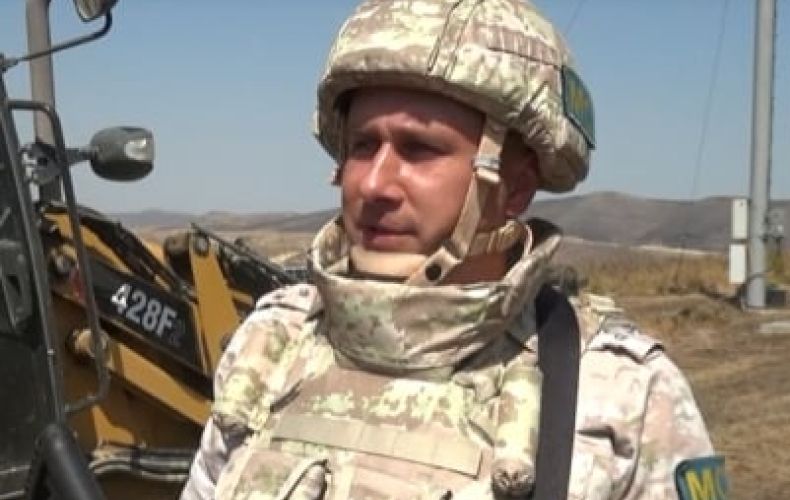Russian peacekeepers provide security during construction of dirt road to cell tower in Artsakh