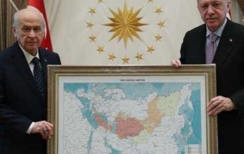 Turkish Nationalist Movement Party gifts Erdogan a map of Turkic World, with a part of Russia 'seized'
